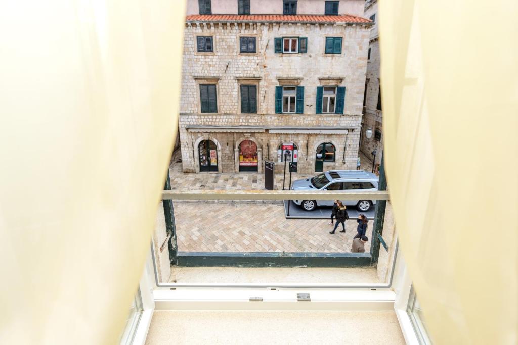 an overhead view of a city street from a building at Studio Apartments Stradun in Dubrovnik