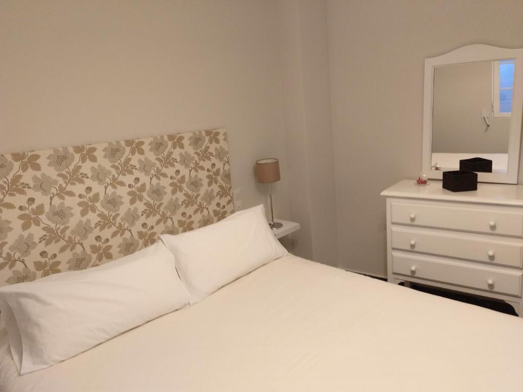 A bed or beds in a room at Apartamento valencia centro