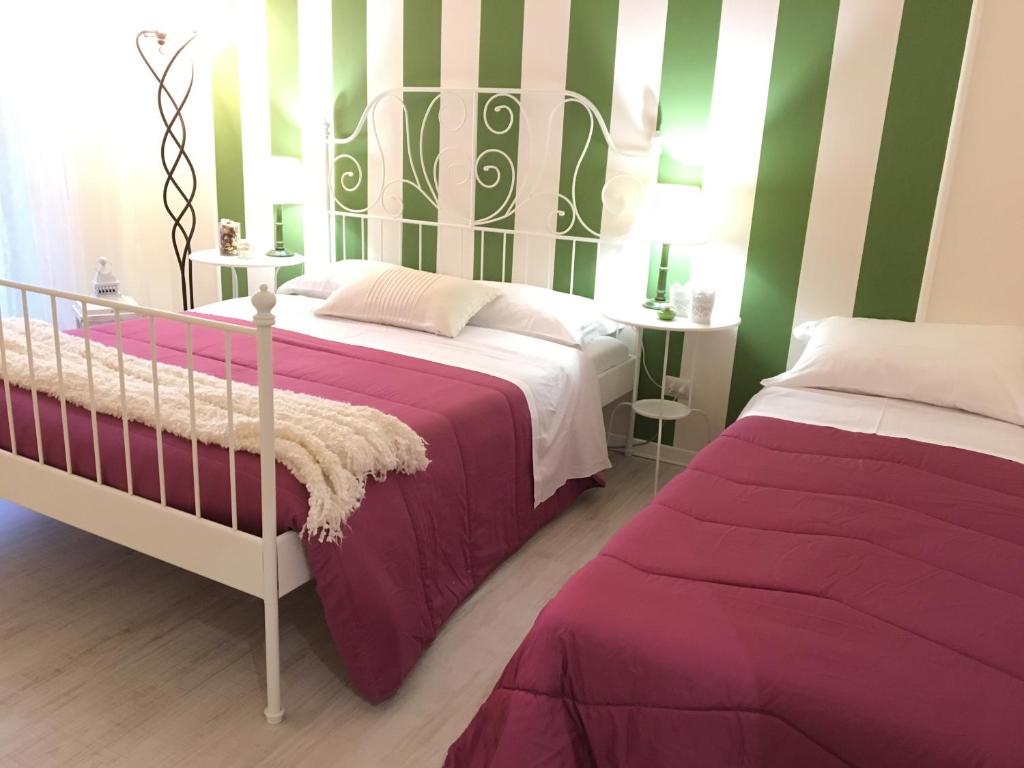 Postel nebo postele na pokoji v ubytování Il Re degli Scalzi