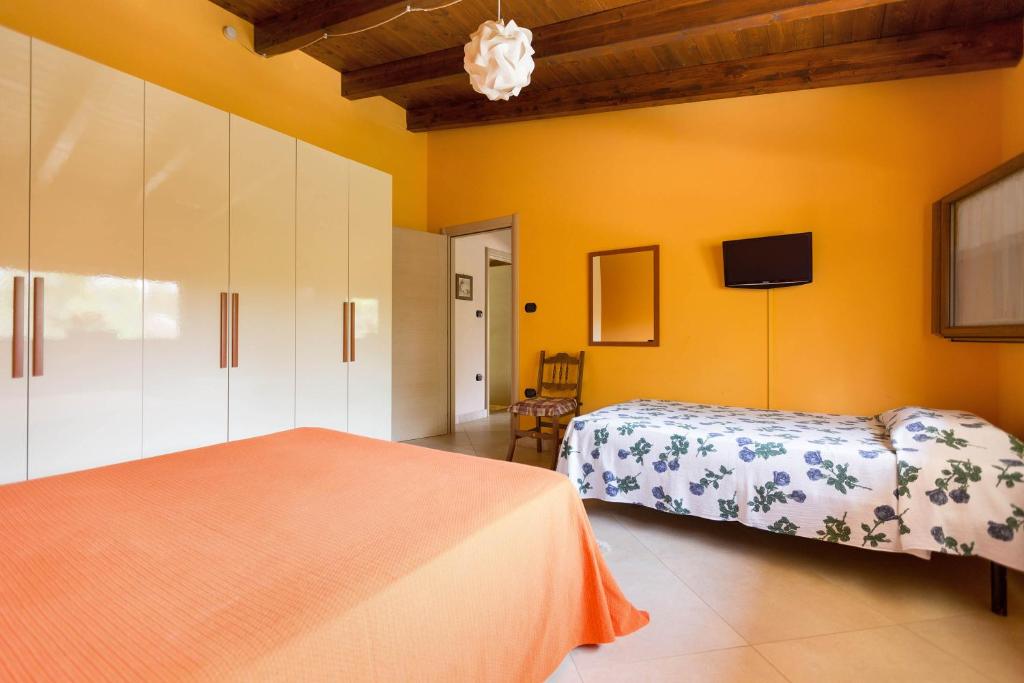 Łóżko lub łóżka w pokoju w obiekcie Villa Pizzi by Perle di Puglia