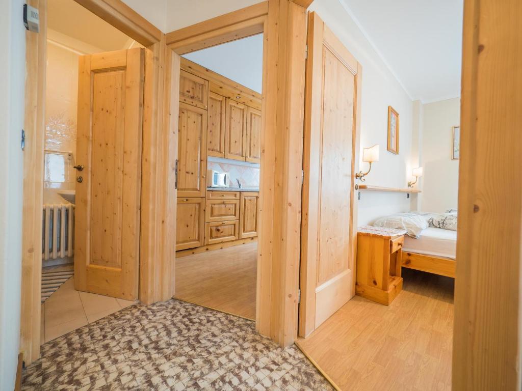 Łóżko lub łóżka w pokoju w obiekcie Apartments & Rooms MyHolidayLivigno