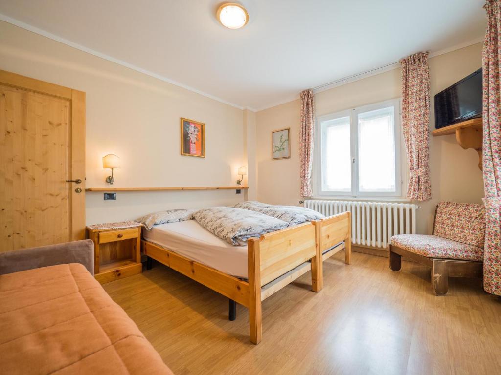 Łóżko lub łóżka w pokoju w obiekcie Apartments & Rooms MyHolidayLivigno