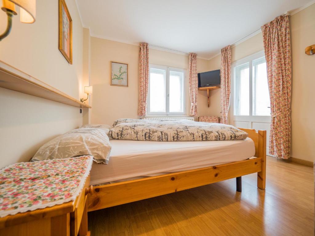 Łóżko lub łóżka w pokoju w obiekcie Apartments & Rooms MyHolidayLivigno