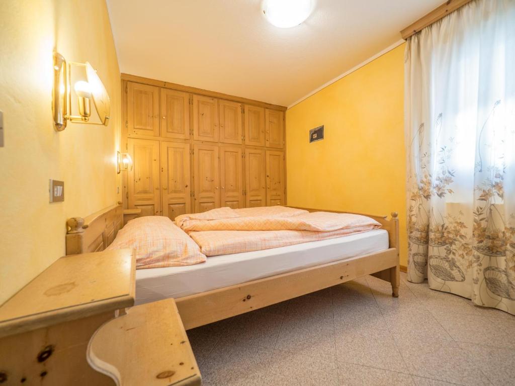Łóżko lub łóżka w pokoju w obiekcie Apartments & Rooms MyHolidayLivigno