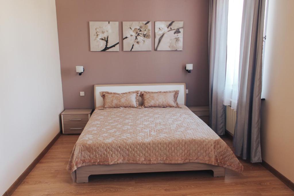 Ένα ή περισσότερα κρεβάτια σε δωμάτιο στο Sad Dolgoletiya Hotel