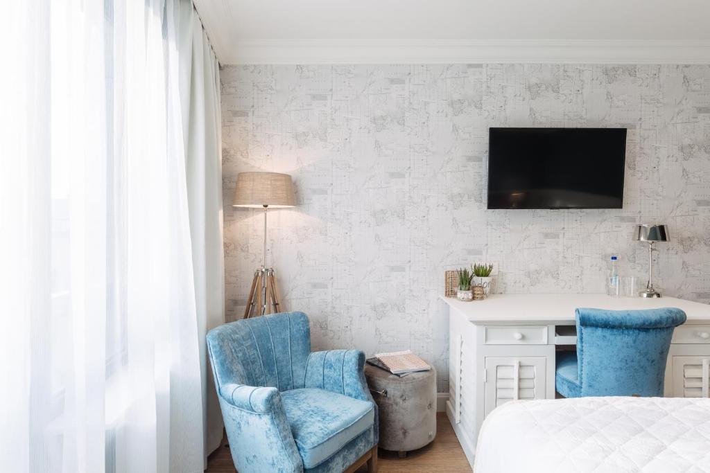 TV a/nebo společenská místnost v ubytování Hotel Cocoon