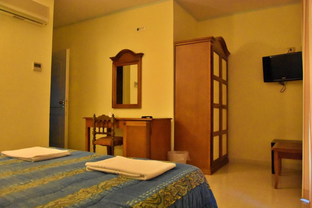 A bed or beds in a room at Hotel Casa Mia