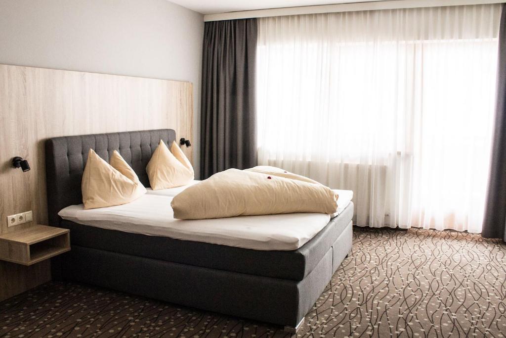 Кровать или кровати в номере Panorama Lodge Hochfügen