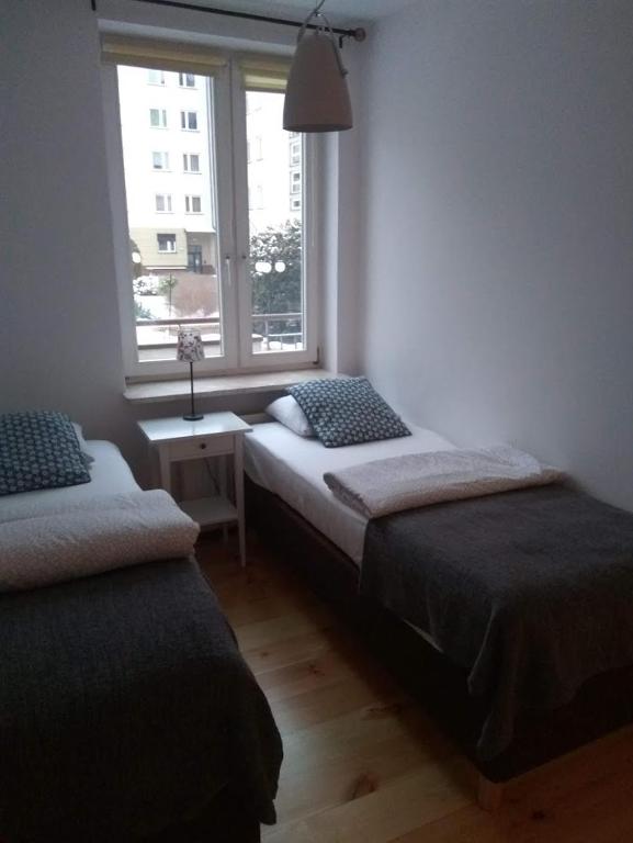Posteľ alebo postele v izbe v ubytovaní KEN 15
