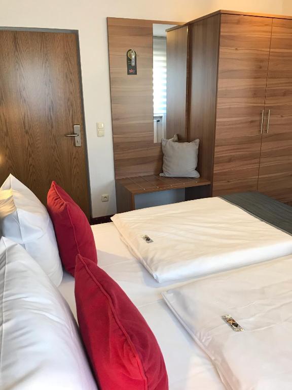 Postel nebo postele na pokoji v ubytování Hotel Rose