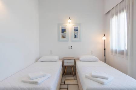 Postel nebo postele na pokoji v ubytování La Noi Houses