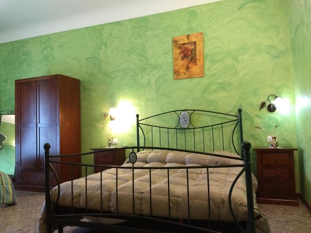 Postel nebo postele na pokoji v ubytování Palazzo Aprile