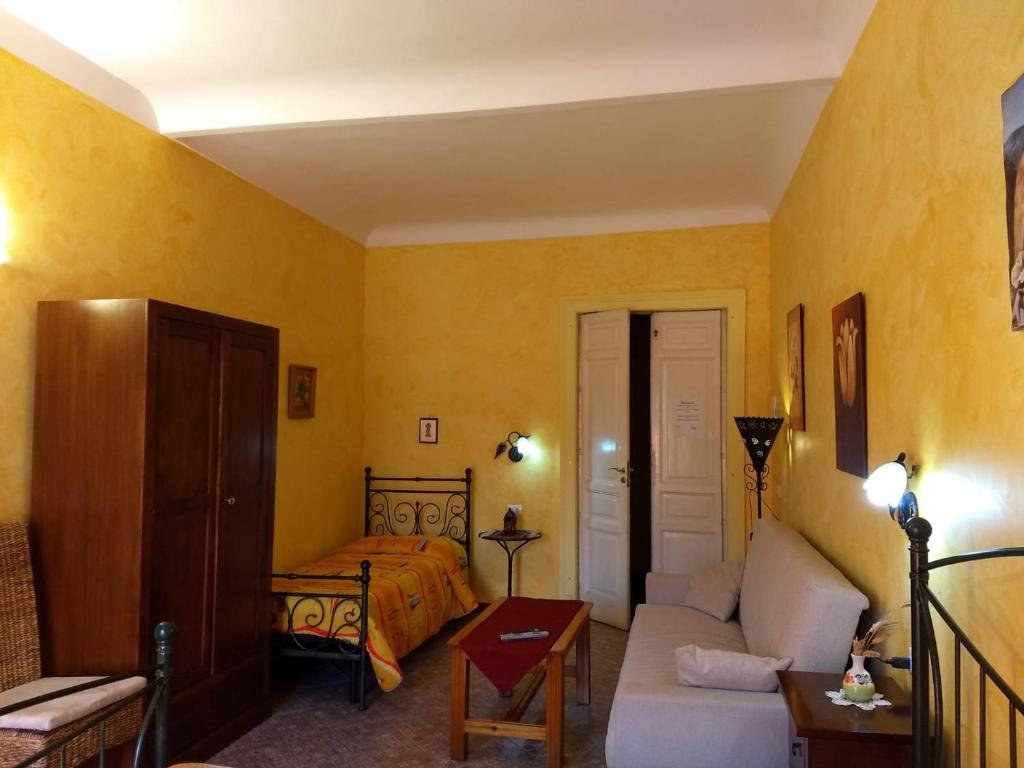 Postel nebo postele na pokoji v ubytování Palazzo Aprile