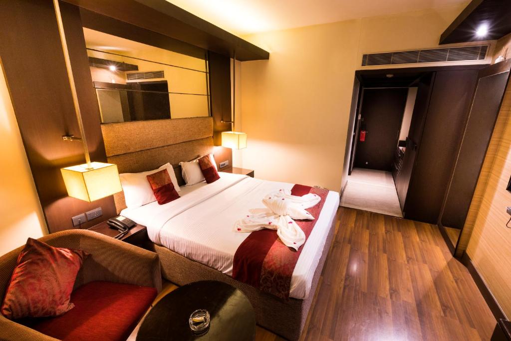 Säng eller sängar i ett rum på Hotel Grand Residence
