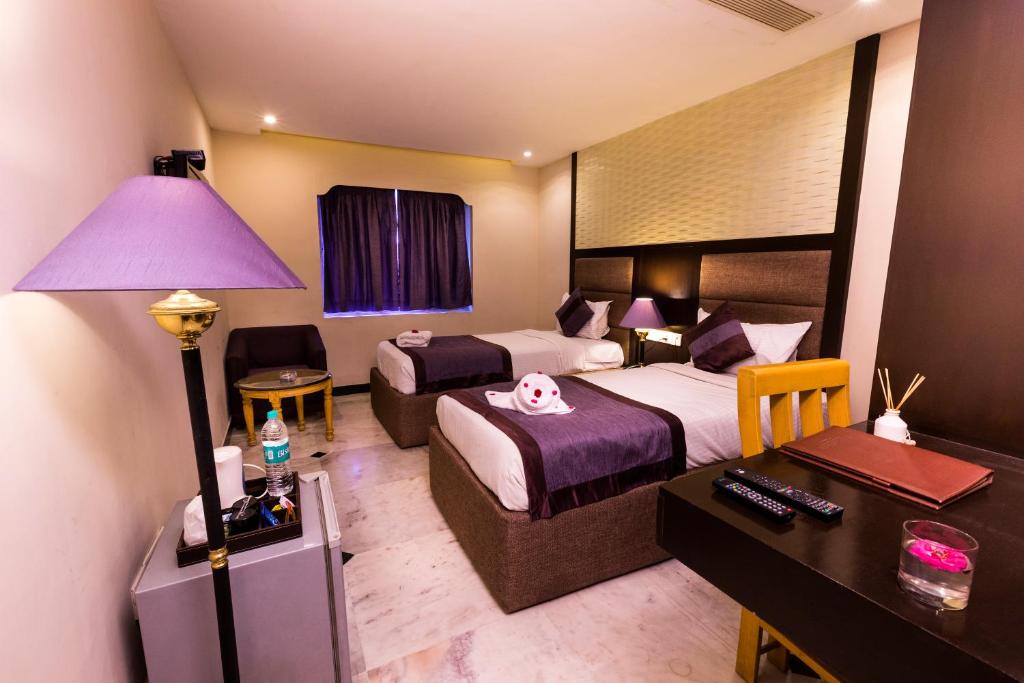 Postel nebo postele na pokoji v ubytování Hotel Grand Residence
