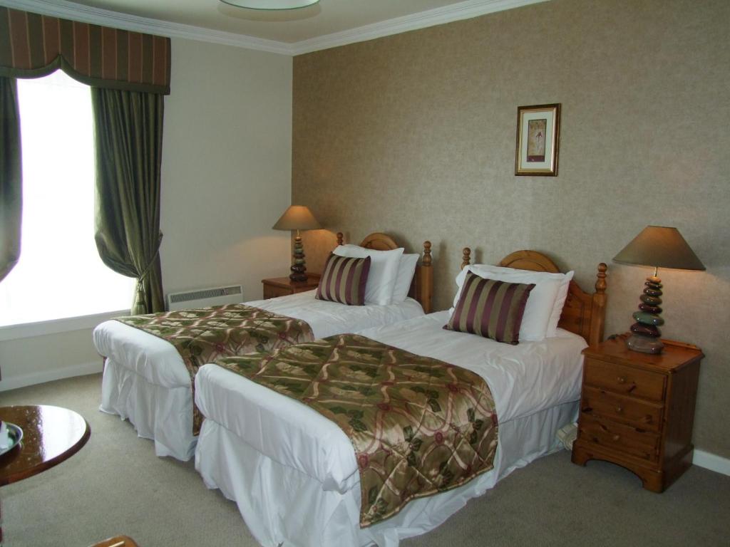 Postel nebo postele na pokoji v ubytování Towers Hotel Glenbeigh