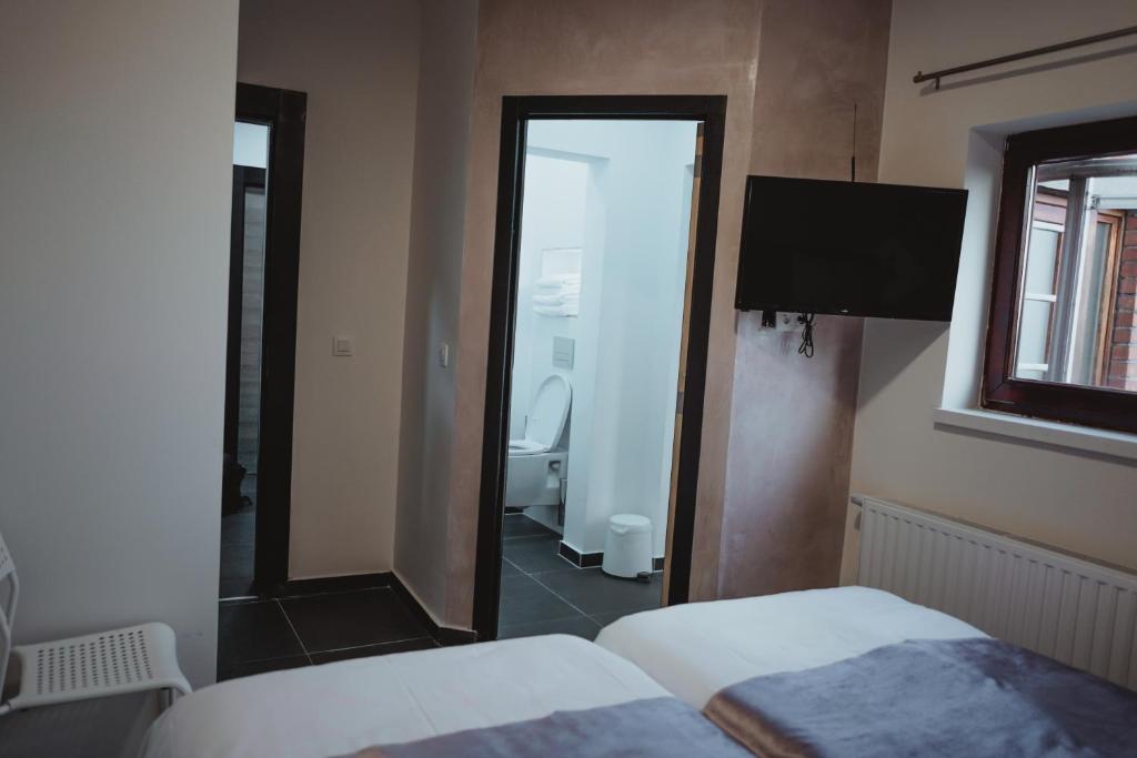 Postel nebo postele na pokoji v ubytování Hôtel onyx expo