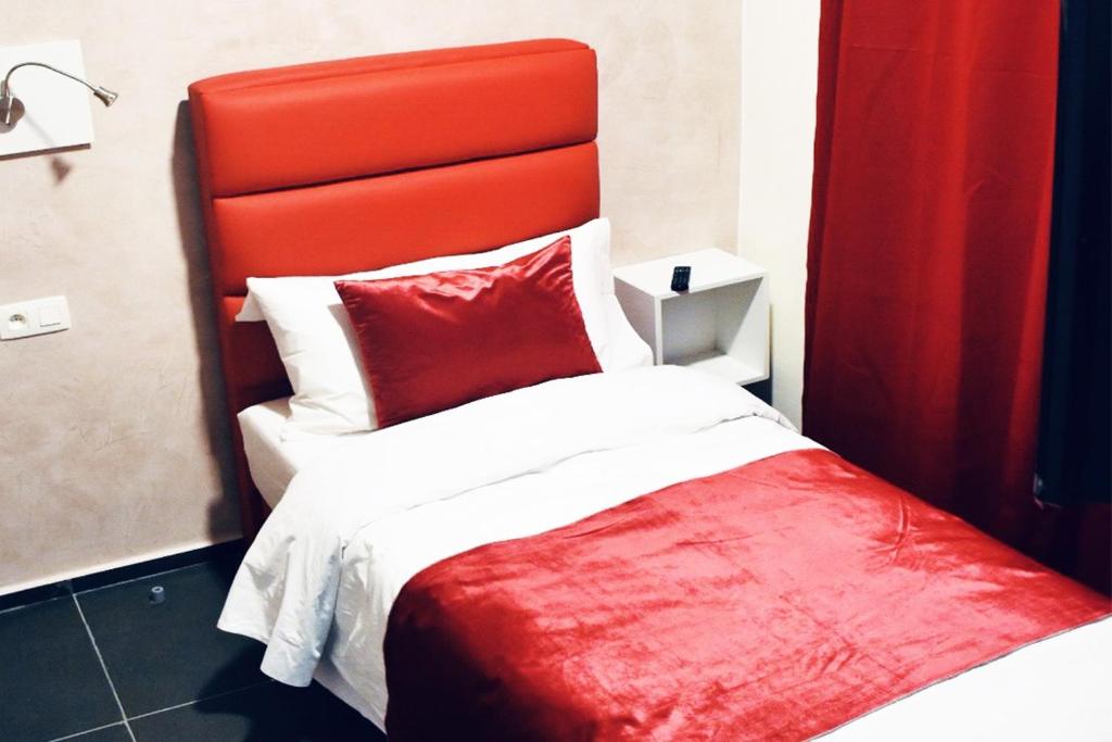 Postel nebo postele na pokoji v ubytování Hôtel onyx expo