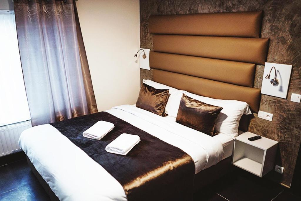 Postel nebo postele na pokoji v ubytování Hôtel onyx expo