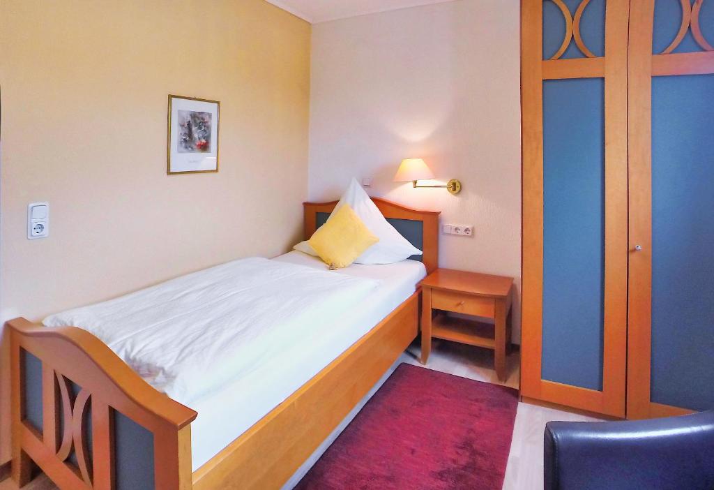 Postel nebo postele na pokoji v ubytování Hotel Maurer