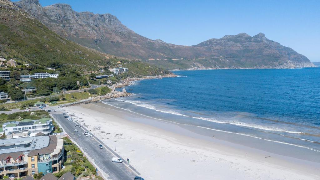 an aerial view of a beach with a mountain at The beachclub 17 in Hout Bay