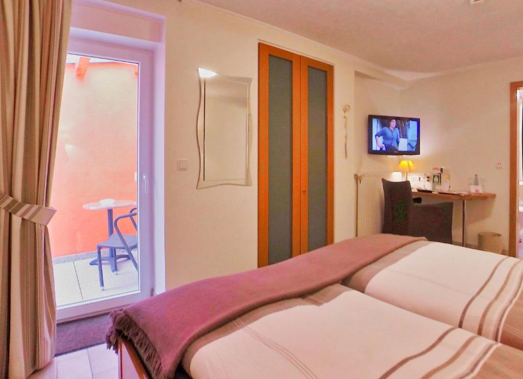 Postel nebo postele na pokoji v ubytování Hotel Maurer