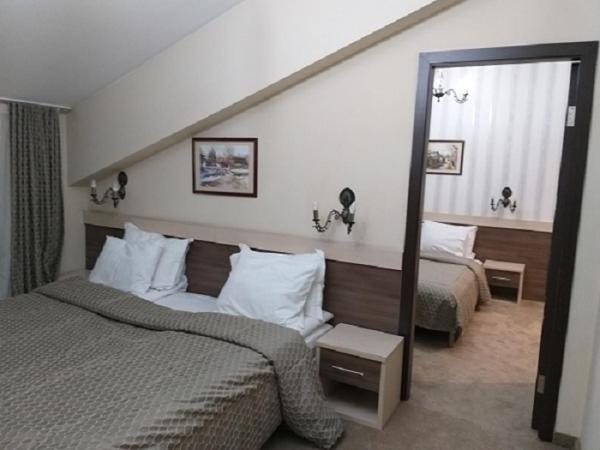Postel nebo postele na pokoji v ubytování Spa Hotel Kleptuza