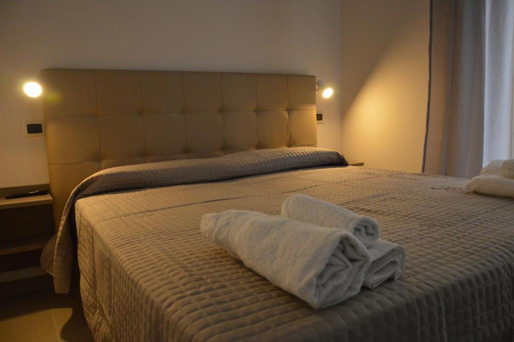Postel nebo postele na pokoji v ubytování Hotel Sant'Elena