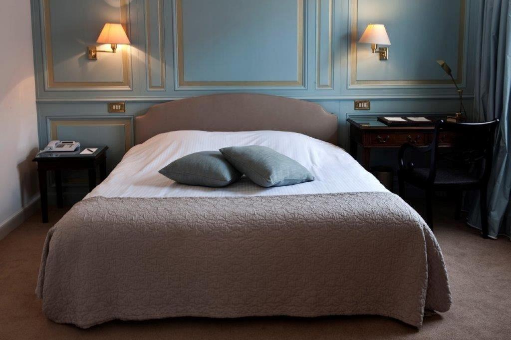 Postel nebo postele na pokoji v ubytování Hotel Damier Kortrijk