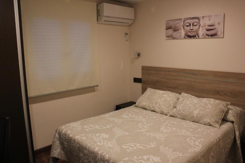 Posteľ alebo postele v izbe v ubytovaní Hostal Extremeño