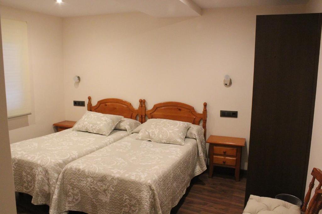 Posteľ alebo postele v izbe v ubytovaní Hostal Extremeño