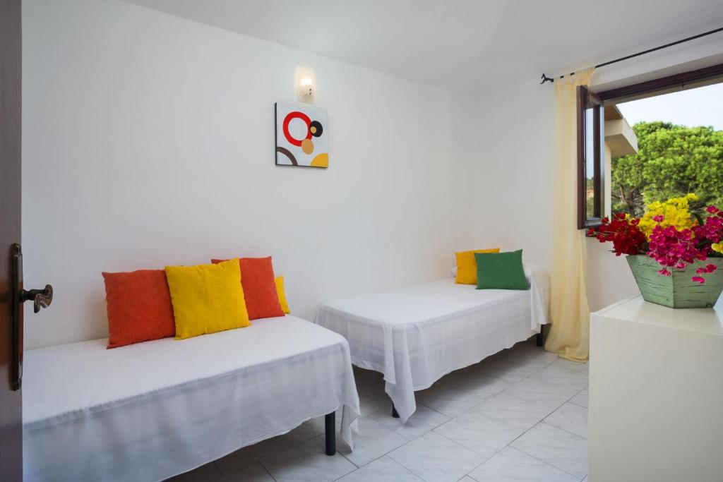 Postel nebo postele na pokoji v ubytování Residence Bougainvillae