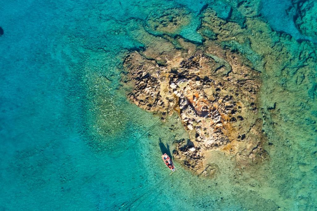 an aerial view of a small island in the water at Parian Boutique Hotel in Naousa