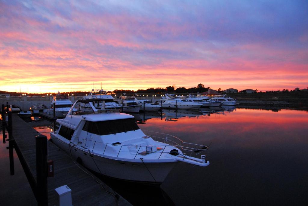 a group of boats docked in a marina at sunset at Marina Inn at Grande Dunes in Myrtle Beach