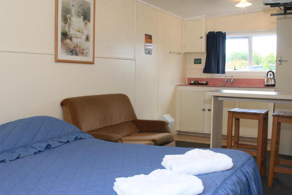 Postel nebo postele na pokoji v ubytování Alma Motel