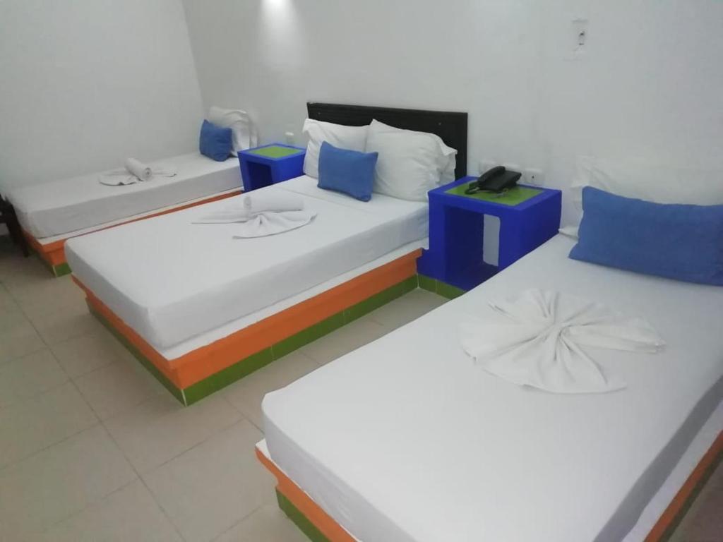 Postel nebo postele na pokoji v ubytování Hotel Guadaira Resort