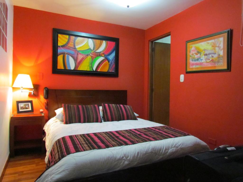 Postel nebo postele na pokoji v ubytování Hotel Apartasuite Normandia