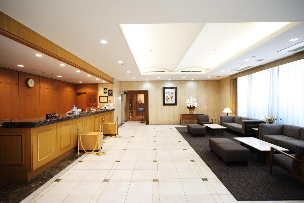 a lobby of a hospital with couches and a waiting room at Hotel Sunroute Asakusa in Tokyo