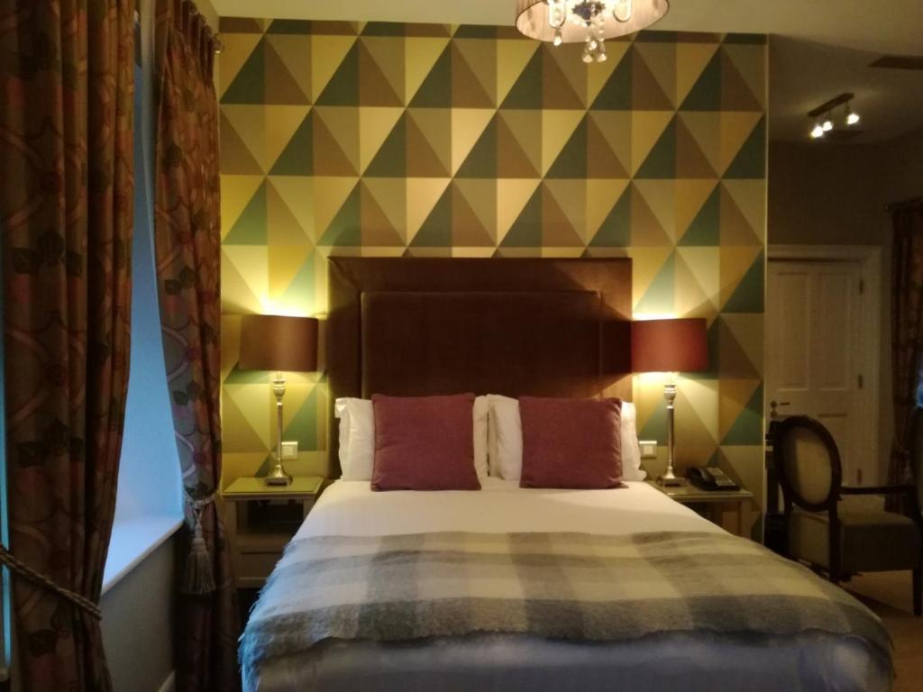 Postel nebo postele na pokoji v ubytování No.1 Pery Square Hotel & Spa