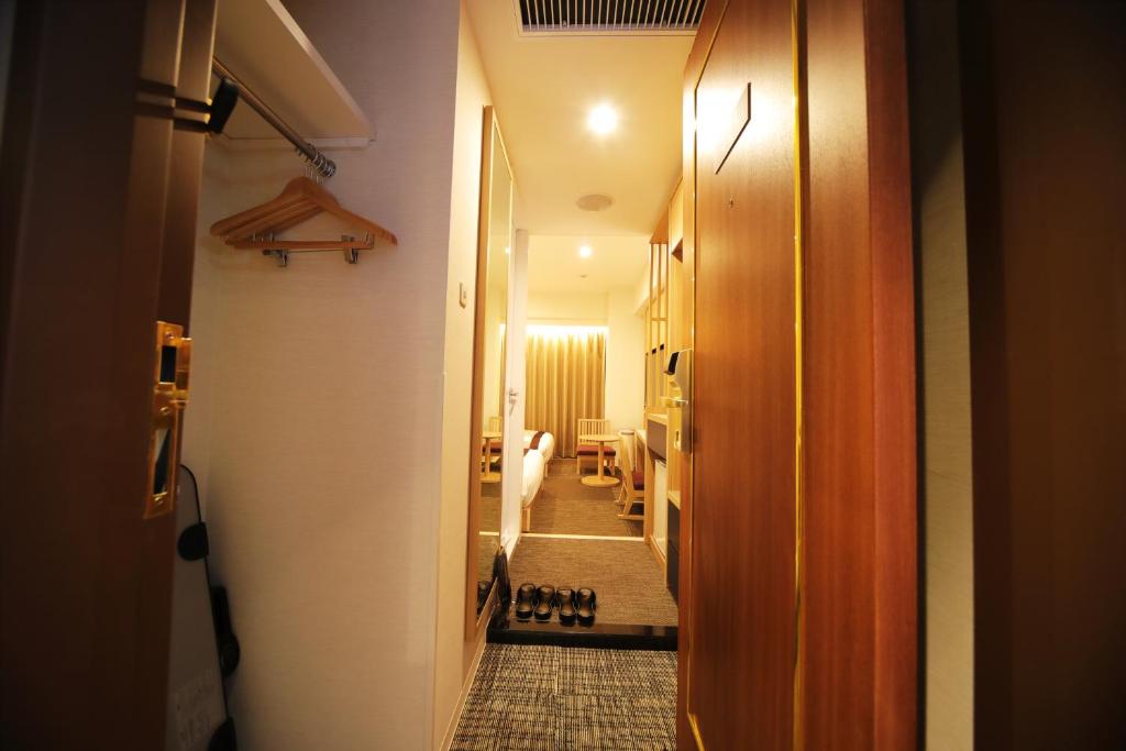 Postel nebo postele na pokoji v ubytování Hotel Sunroute Asakusa