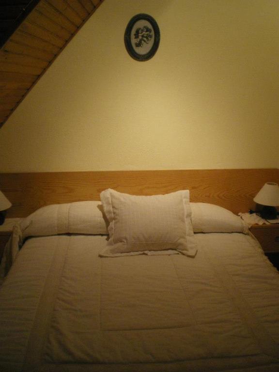 Postel nebo postele na pokoji v ubytování Casa Aranesa