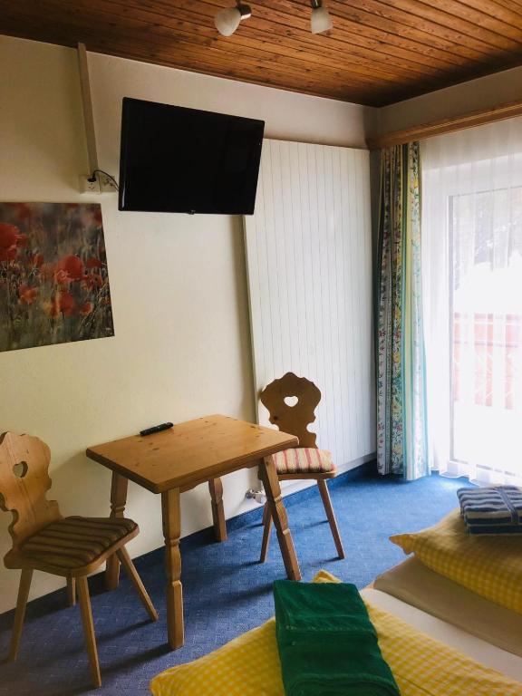 TV a/nebo společenská místnost v ubytování Garni-Appartement Collina