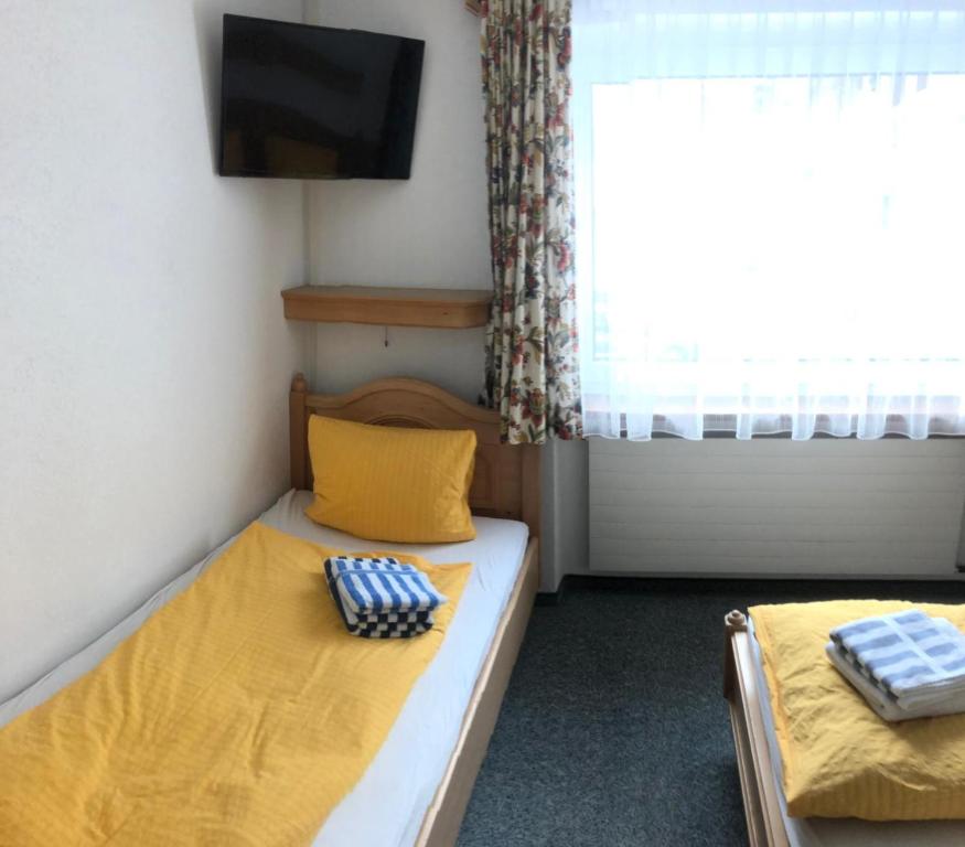 Postel nebo postele na pokoji v ubytování Garni-Appartement Collina
