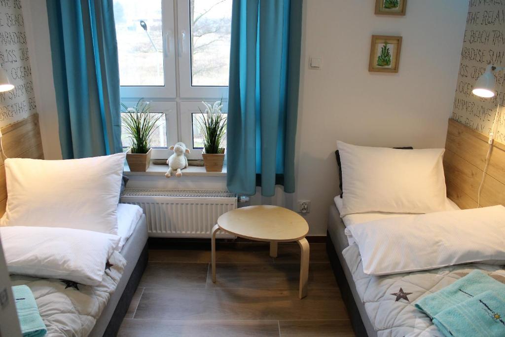 Posteľ alebo postele v izbe v ubytovaní Apartament Comfort