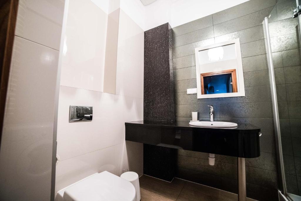 Kúpeľňa v ubytovaní CracWoW VIP Apartment