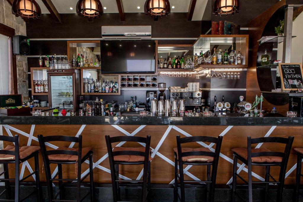 a bar with wooden counter and stools at innova8ion in Bethlehem