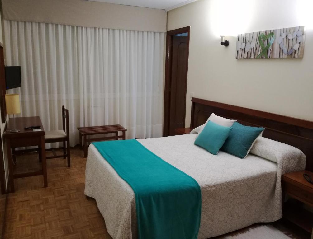 Postel nebo postele na pokoji v ubytování Hotel Almendra