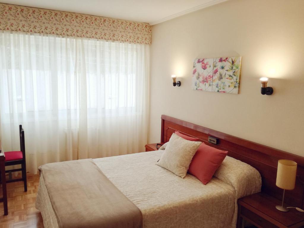 Postel nebo postele na pokoji v ubytování Hotel Almendra