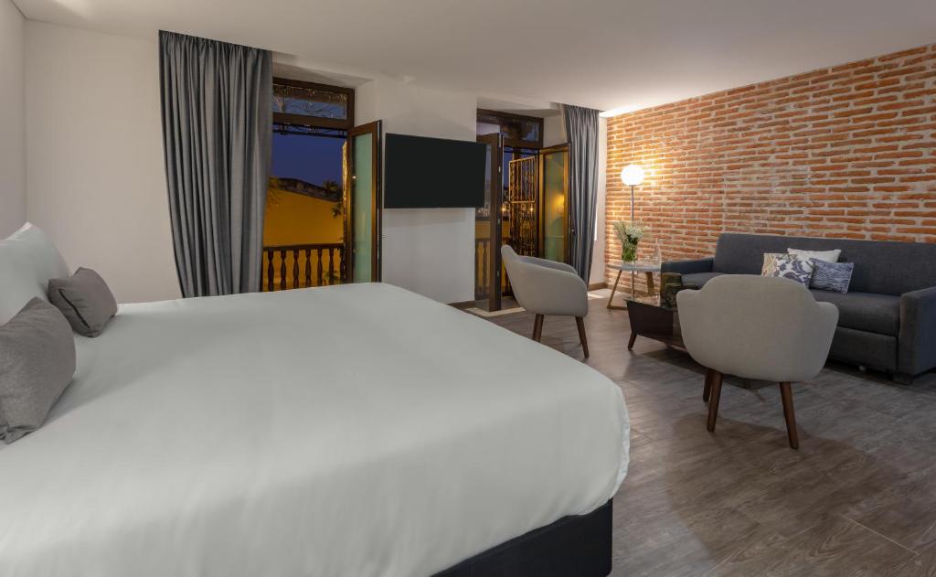 Postel nebo postele na pokoji v ubytování Hotel Santa Catalina