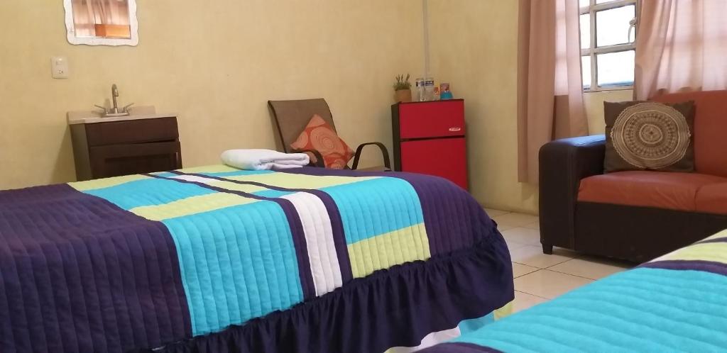 Postel nebo postele na pokoji v ubytování Otoch Béek Calakmul